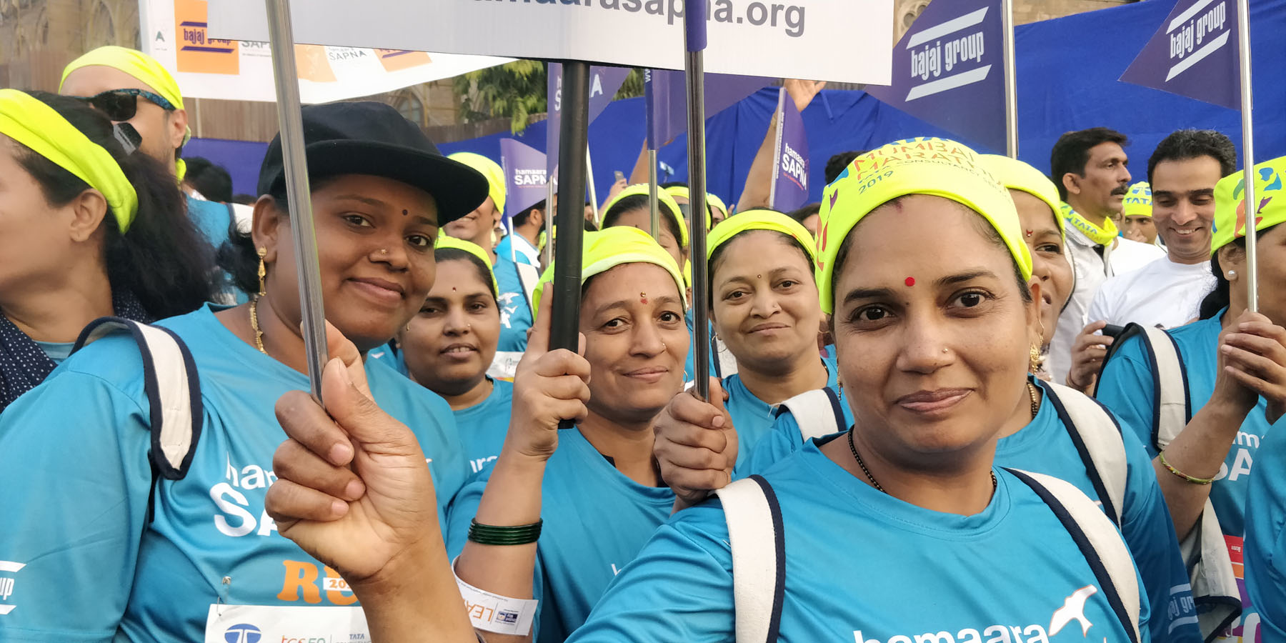 Dharavi Centre beneficiaries with staff of Dharavi Centre in the Marathon. They are proud to carry the placards and represent Hamaara Sapna