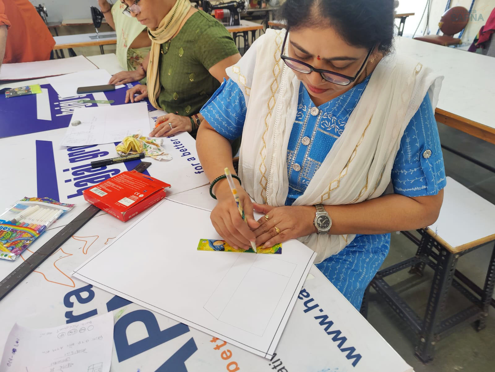 Beneficiaries from Tardeo centre making their posters on Prevent Cyber Crime.