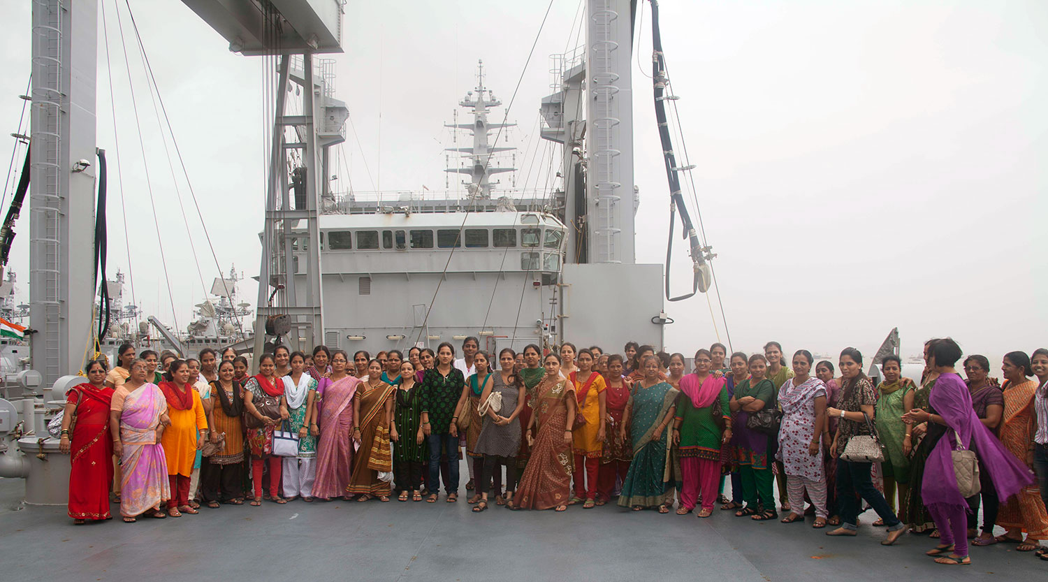 Beneficiaries standing outside the INS Deepak (July, 2013)